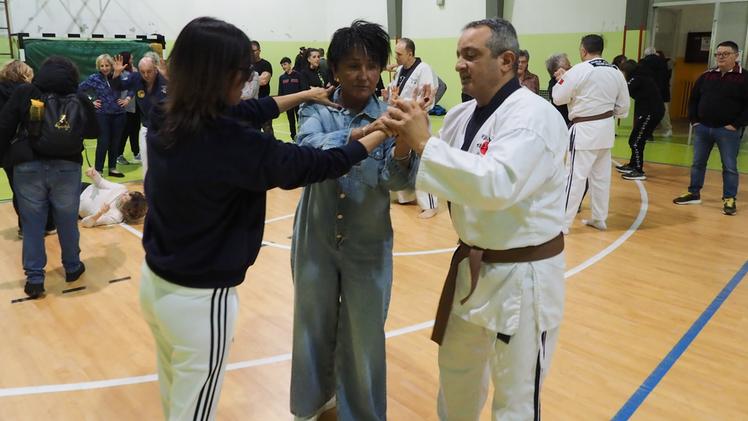 The initiative Neighborhood gathers at the gym for self-defense course